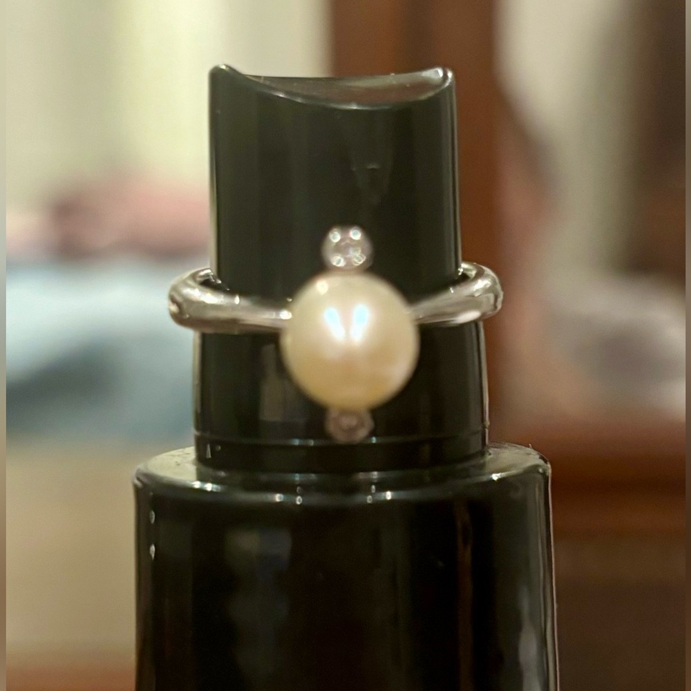 Silver toned pearl ring with cubic zirconia accents